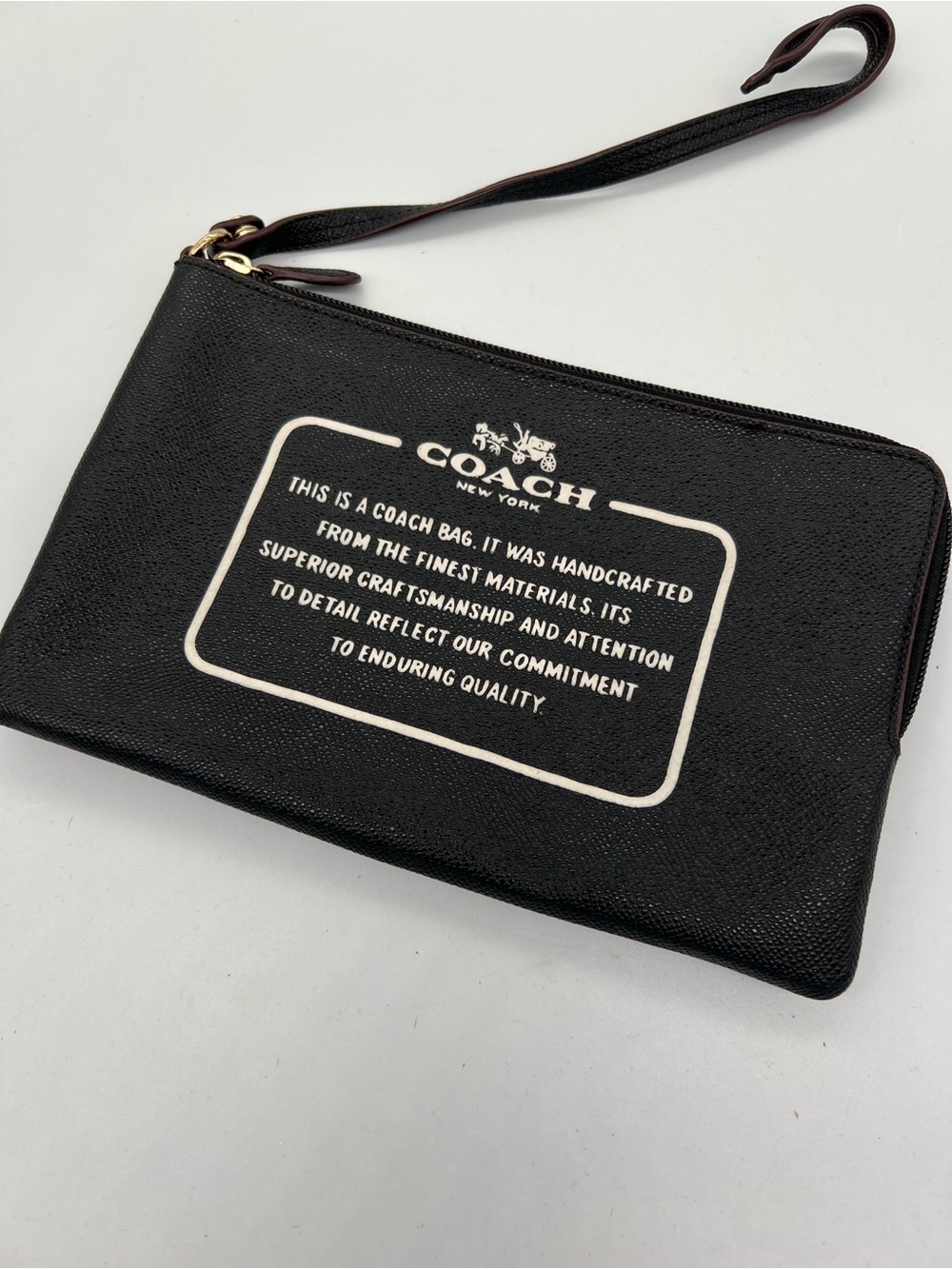 Coach Black Leather Wristlet Pouch with Cream Logo Panel